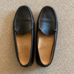 Tod’s black leather loafers